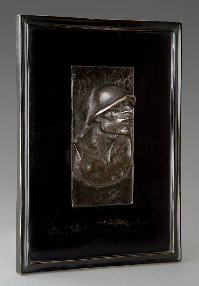 « Tête de mineur en bas-relief »